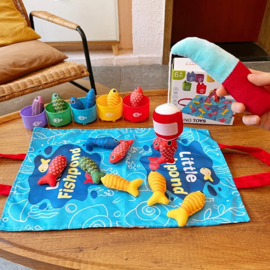 Mat laid out with the five numbered cups lined up behind it and the plush rod in hand